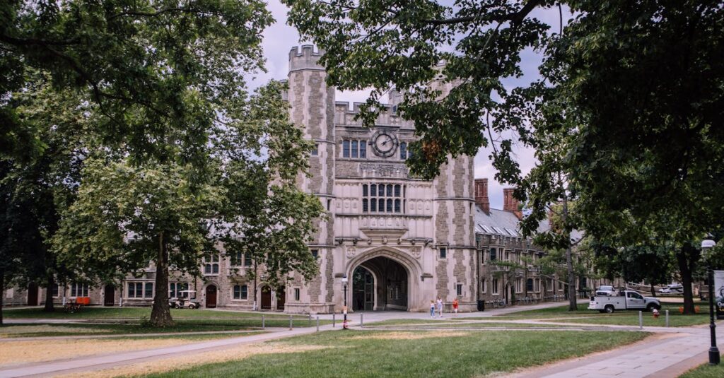 Explore the iconic gothic architecture of Princeton University, surrounded by lush greenery.